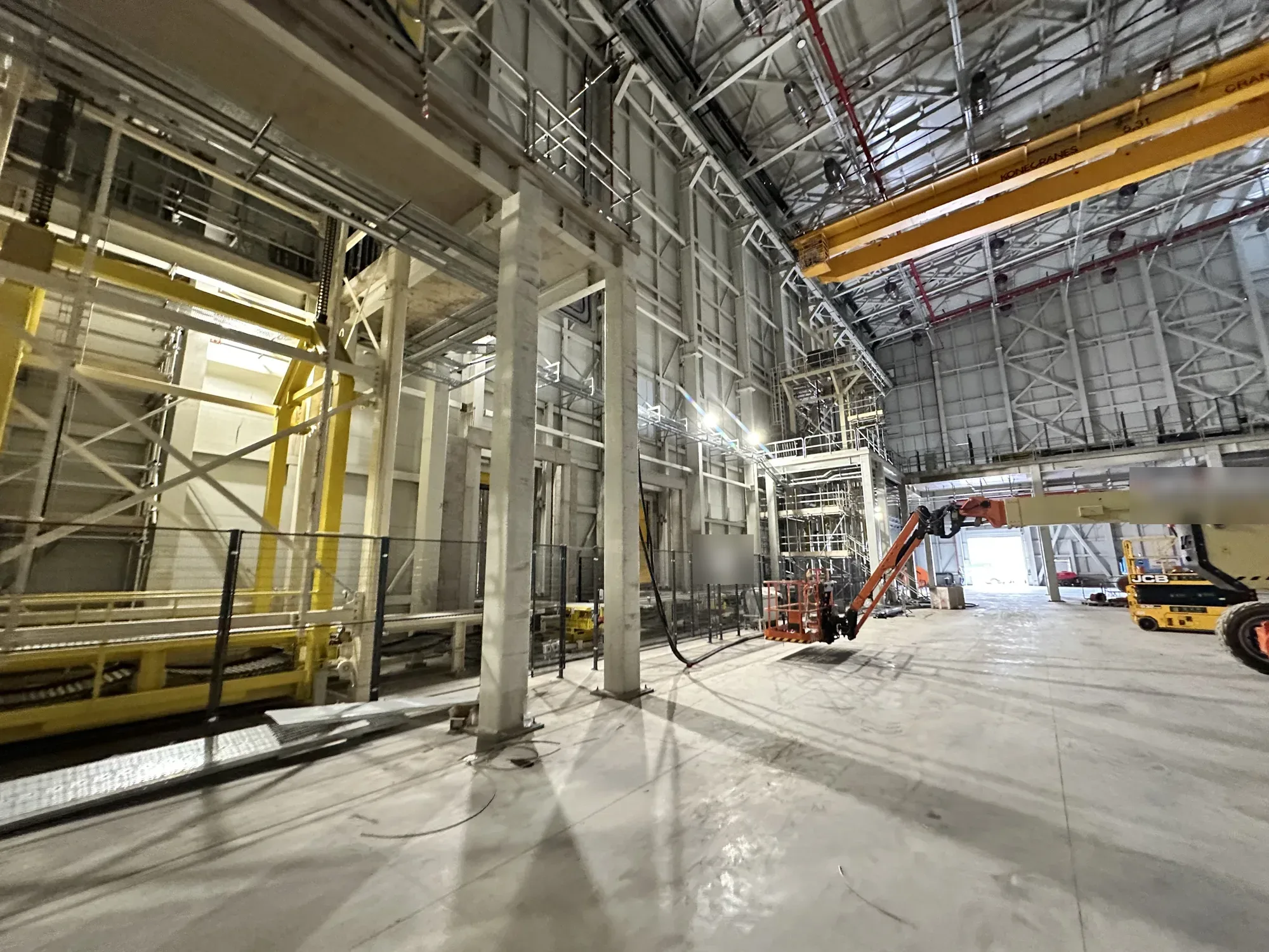 Lighting installation in progress in a large industrial unit