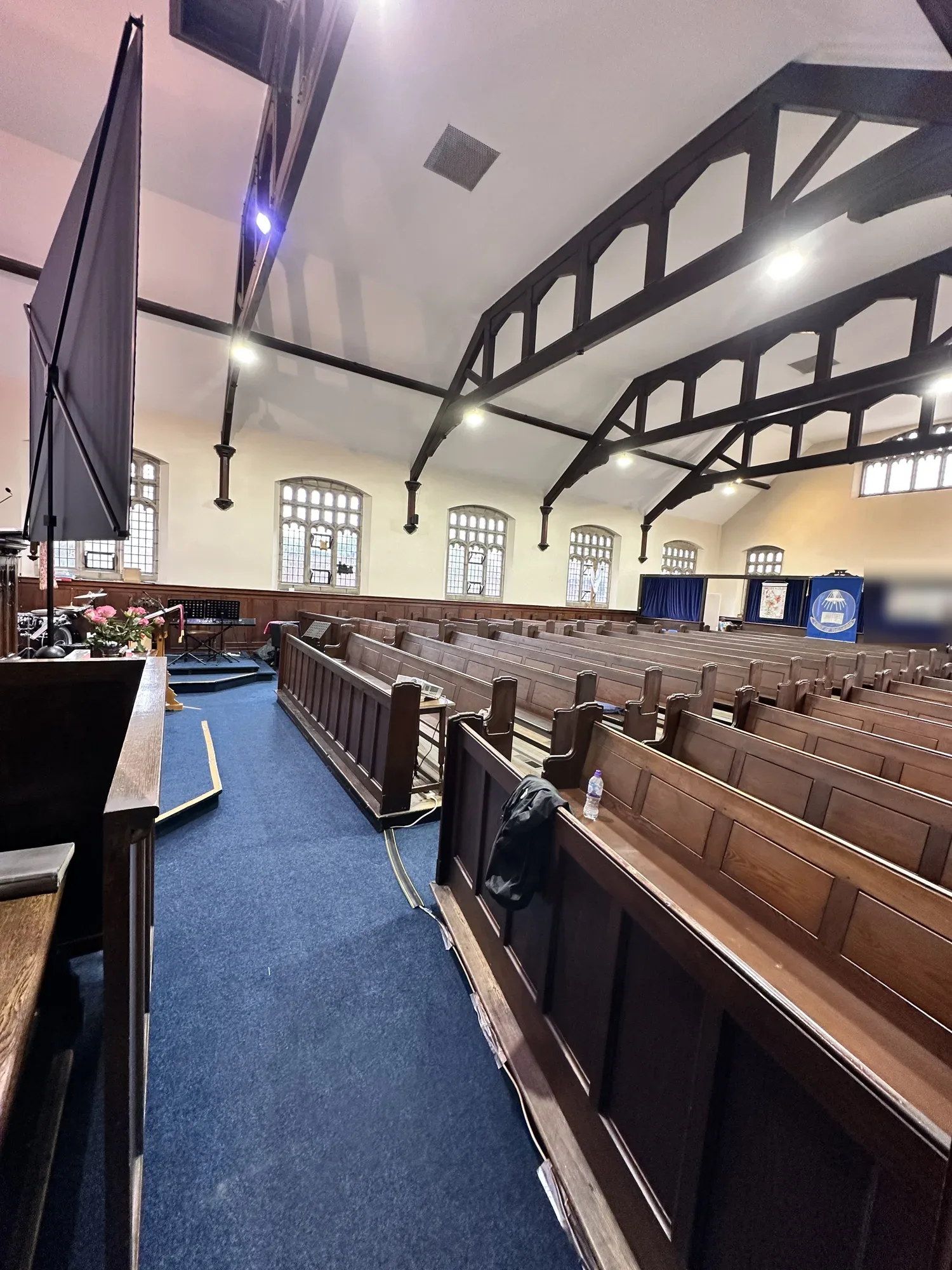 Church interior with new ceiling spotlights over the pews