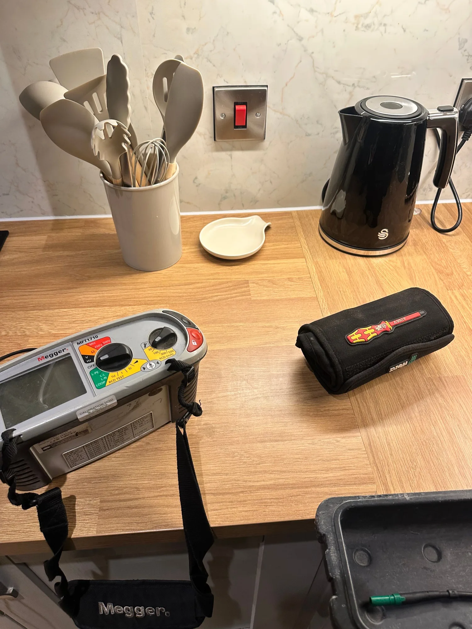 Megger multifunction tester on a kitchen worktop during an EICR