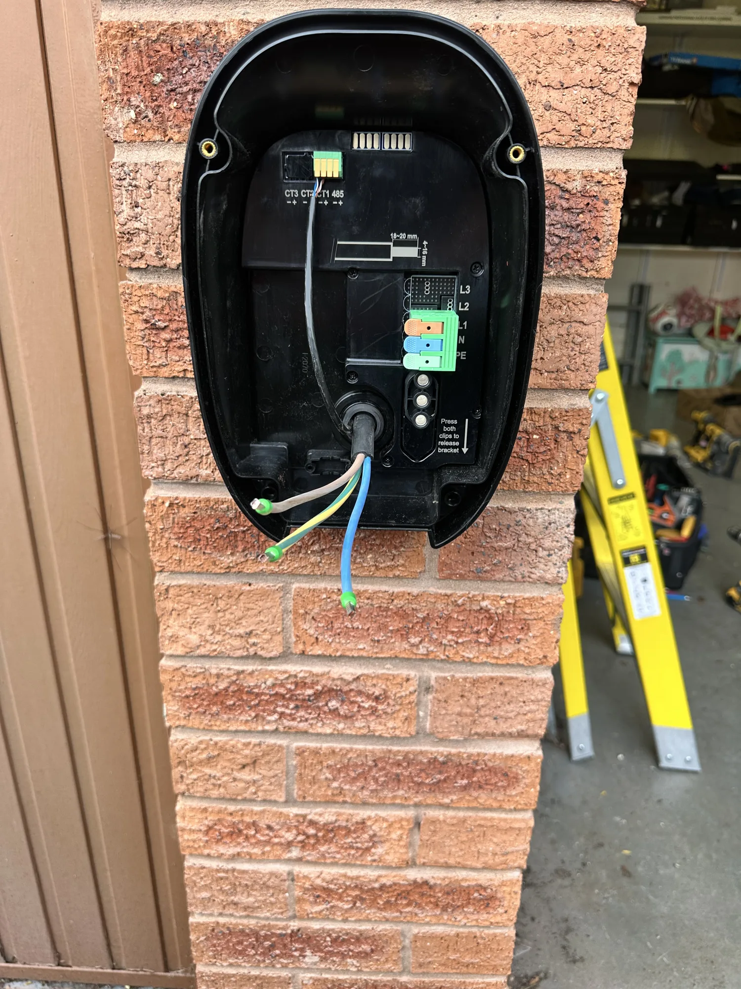 EV charger wiring and terminals inside the unit before the cover goes on